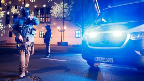 Members of police work at a Christmas market after a car drove into a group of people, according to local media, in Magdeburg, Germany, December 20, 2024