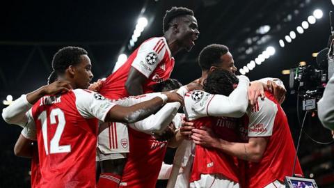 Arsenal players celebrating after scoring