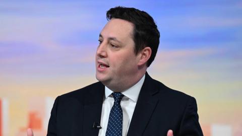 Mayor Ben Houchen on the BBC's Sunday with Laura Kuenssberg. He has short black hair and is wearing a blazer and blue tie.