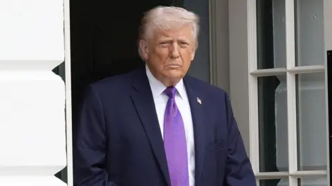 US President Donald Trump US walks out the White House in Washington, DC