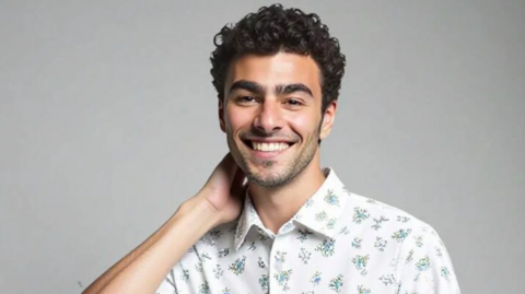 Luigi Mangione's face on a model, selling a shirt on Shein. The model is wearing a white shirt
