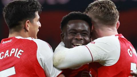 Bukayo Saka celebrates with Arsenal team-mates