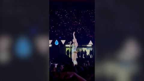 Taylor Swift waves to the crowd during her concert at the Principality Stadium