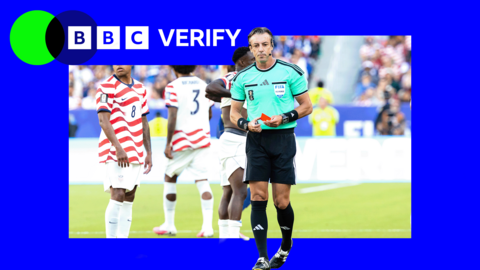 FIFA referee Raphael Claus holding a red card during a match between USA and Bosnia and Herzegovina