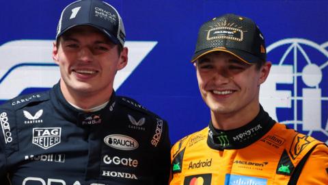 Lando Norris and Max Verstappen smile and acknowledge the crowd after qualifying for the Las Vegas Grand Prix