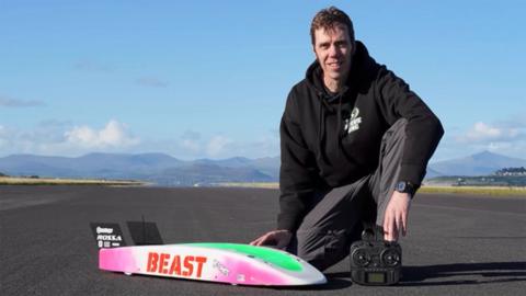 A remote control car and a man