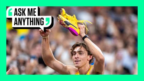 Armand Duplantis holds up his claw shoes