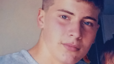 Image shows Jensen Westhead, who has short dark hair and is wearing a t-shirt, looking at the camera