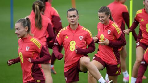 Ella Powell (centre) training with her Wales team mates