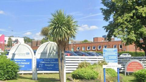 An image of the front of the Northern General site.  The picture focuses on the signs at the front of the hospital.