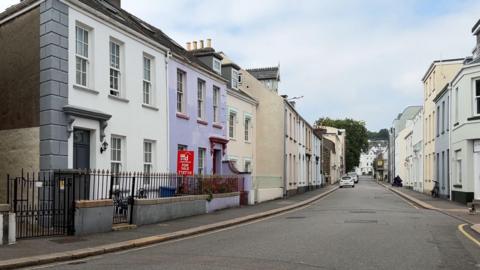 St Helier residential streets - rows of houses on either side of a main road