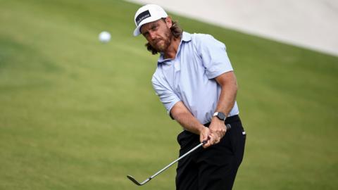 Tommy Fleetwood playing a chip shot