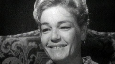 A close up of Simone Signoret smiling