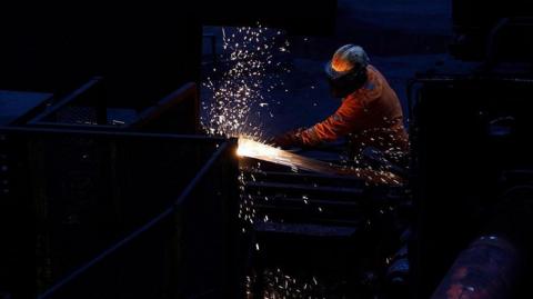 Workers in the rail and sections hot end rolling mill in Scunthorpe