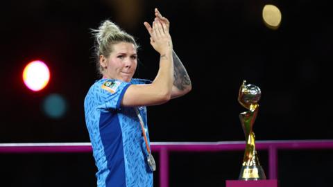 Millie Bright walks past the trophy after England lost the World Cup final 