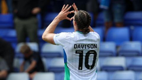 Tranmere Rovers' Josh Davison makes a heart shape with his hands to the crowd after scoring against Shrewsbury