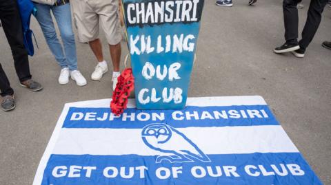 Flags and protest material against Sheffield Wednesday owner Dejphon Chansiri