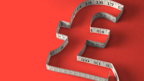 A pound sign etched out with a tape measure
