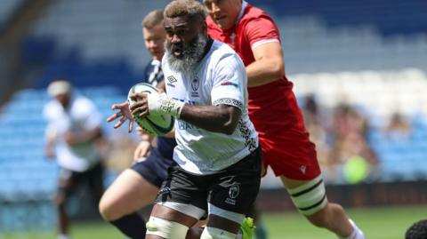  Pita-Gus Sowakula of Fiji races in to score try