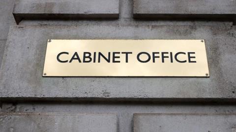Brass plaque saying 'Cabinet Office'