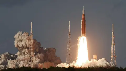 Rocket takes off with huge plume of smoke underneath it