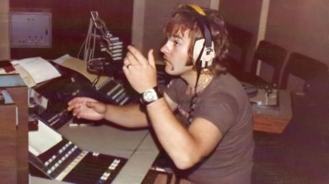 James Stannage in his youth behind radio decks.