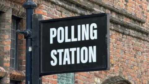 A polling station sign