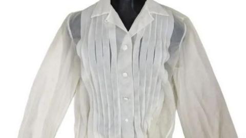 A white long-sleeved ladies' blouse with white buttons