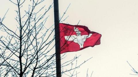 Shows a Parachute Regiment flag in black and white with a maroon background.