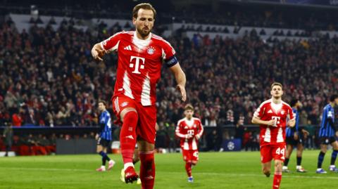 Harry Kane celebrates scoring against Atalanta 