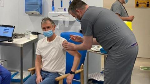 MP Nigel Evans being vaccinated by MP Andrew Stephenson