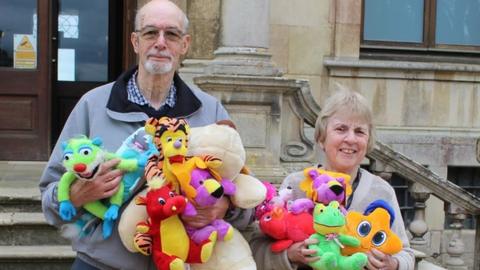 Roy and Ann Pettitt with a number of toys