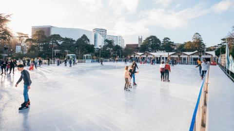 People on a ice rink skating