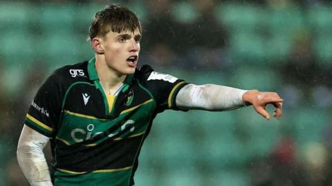 Archie McParland pointing, directing his team-mates during a game for Northampton