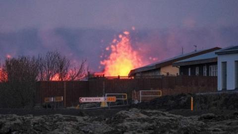 Lava explosions and rising smoke after a volcanic eruption near the town of Grindavik, in the Reykjanes peninsula,