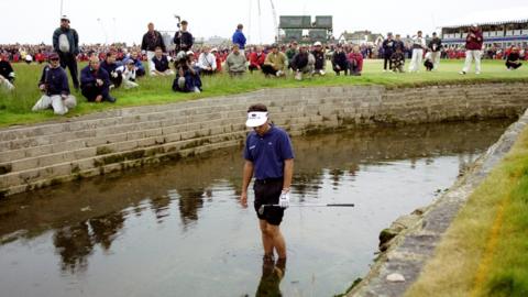 Jean van de Velde in the Barry Burn on the 18th hole during the 1999 Open Championship at Carnoustie