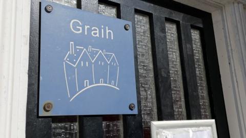 Photo of door with Graih sign