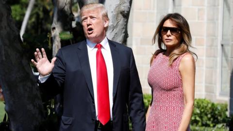 U.S. President Donald Trump talks to reporters about Daca as he arrives with First Lady Melania Trump for the Easter service at Bethesda-by-the-Sea Episcopal Church in Palm Beach, Florida, on 1 April 2018