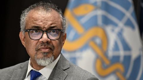 WHO Director-General Tedros Adhanom Ghebreyesus looks on during a press conference