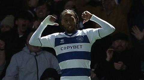 QPR striker Rumarn Burrell points to the name on the back of his short after scoring against West Bromwich Albion.