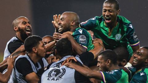 Comoros celebrate their second goal against Ghana