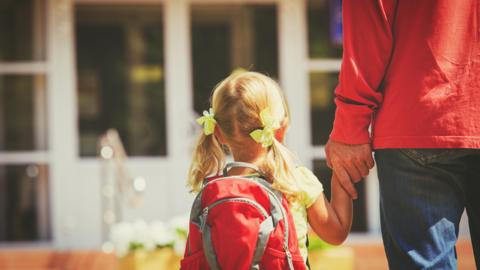 Nursery school pupil arriving