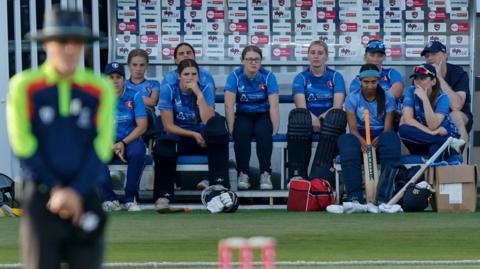 Kent's players watching from the dugout