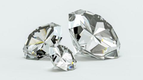 Diamonds of different sizes on white background