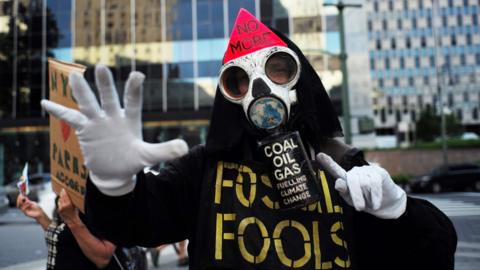 Environmental activists and supporters take part in a demonstration in New York on June 1, 2017, to protest US President Donald Trump"s decision to pull out of the 195-nation Paris climate accord deal