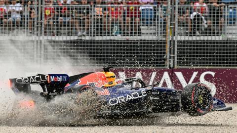 Gravel flies up as Red Bull's Max Verstappen crashes in qualifying for the Australian Grand Prix