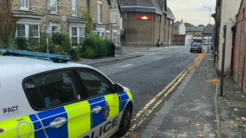 A police car at the scene