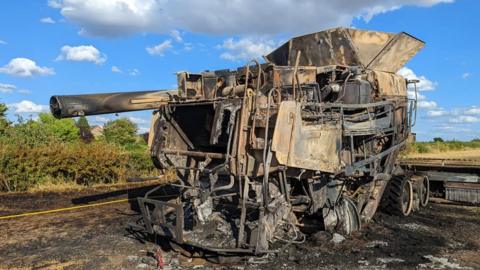 Combine harvester destroyed by fire
