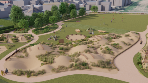 A picture of the proposal for where the playing field is and what it would look like. There is a number of sand as well as a large green space. There is properties in the distance as well as more trees. There is also people pictured walking on the grass.