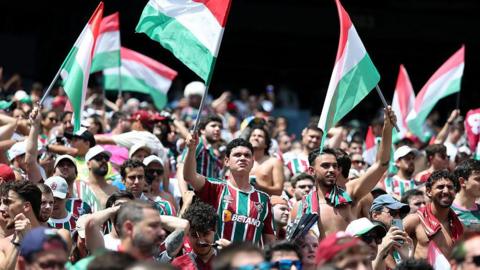 Fluminense fans raise flags in club colours